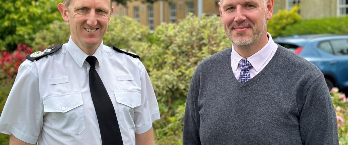 PCC John Campion and Temporary Chief Constable Richard Cooper stood outside Hindlip Hall.